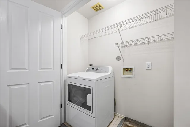 a bathroom with a shower and a mirror