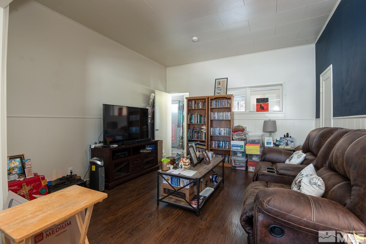 4240 Kings Canyon Road Carson City, NV 89703 - Photo 15 of 25 a living room with furniture and a flat screen tv