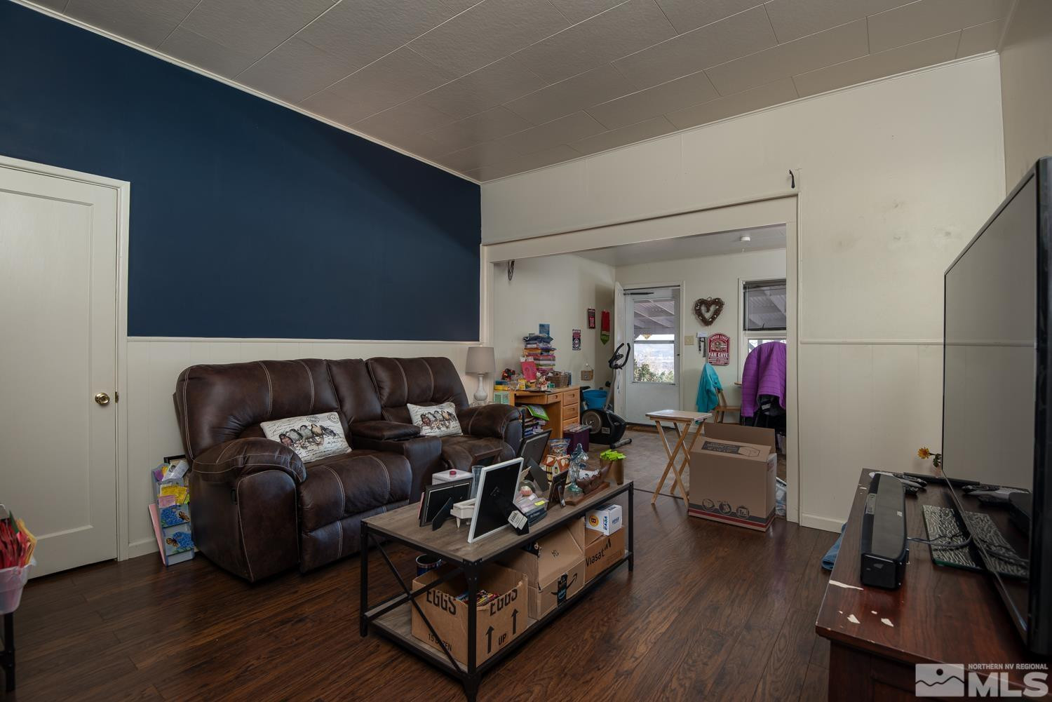 4240 Kings Canyon Road Carson City, NV 89703 - Photo 16 of 25 a living room with furniture and a wooden floor