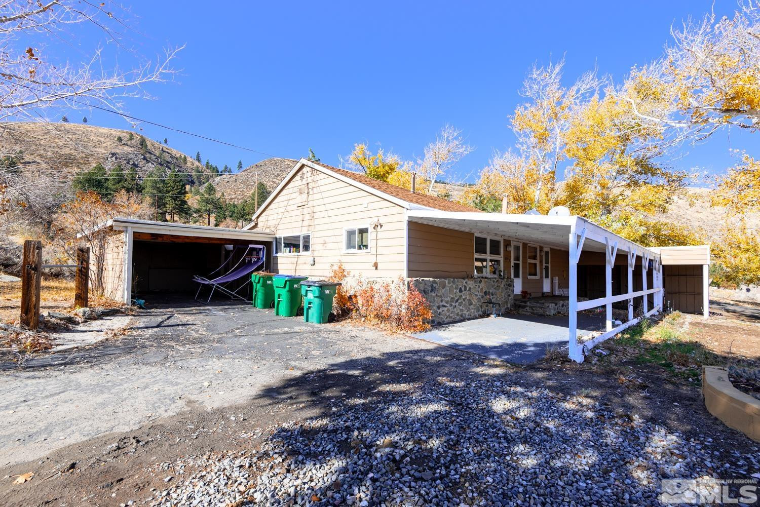 4240 Kings Canyon Road Carson City, NV 89703 - Photo 9 of 25 a view of a house with backyard and a tree
