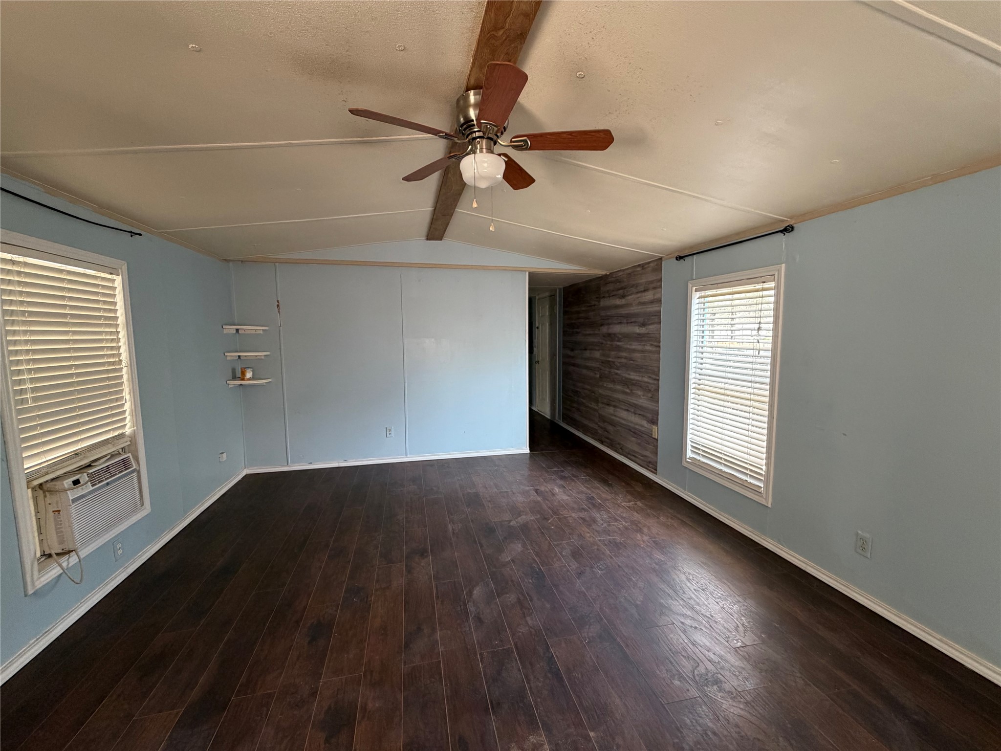 11 June Lane Shepherd, TX 77371 - Photo 19 of 33 a view of an empty room with a window and wooden floor