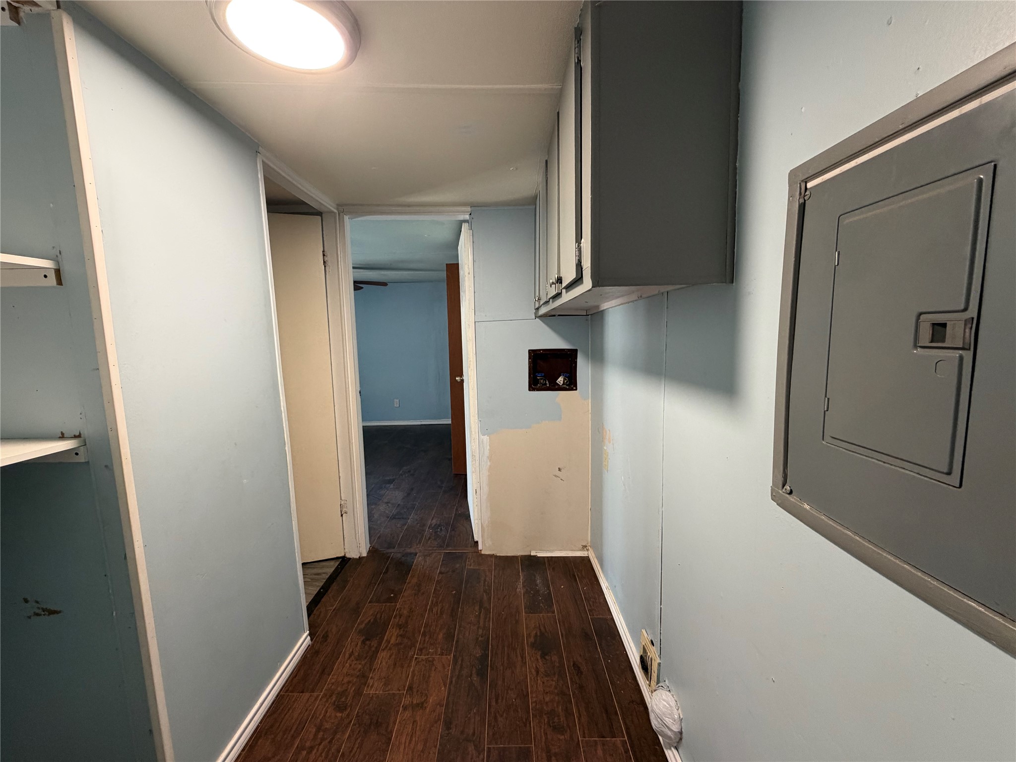 11 June Lane Shepherd, TX 77371 - Photo 22 of 33 a view of a hallway with wooden floor and staircase