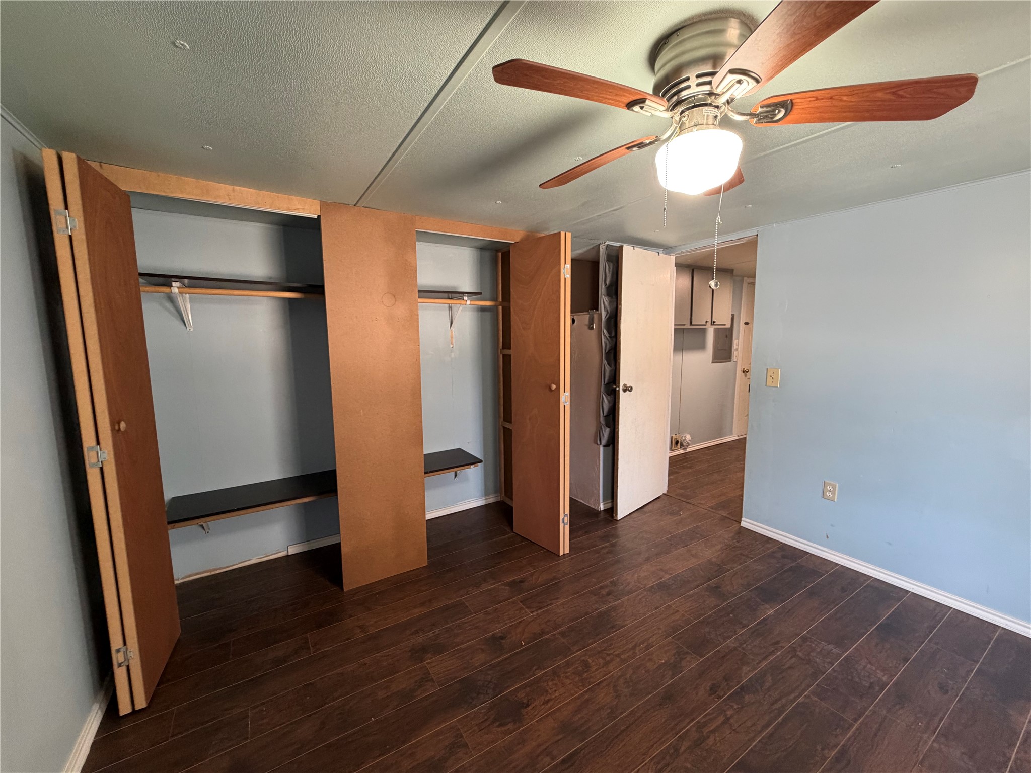 11 June Lane Shepherd, TX 77371 - Photo 24 of 33 an empty room with wooden floor fan and windows