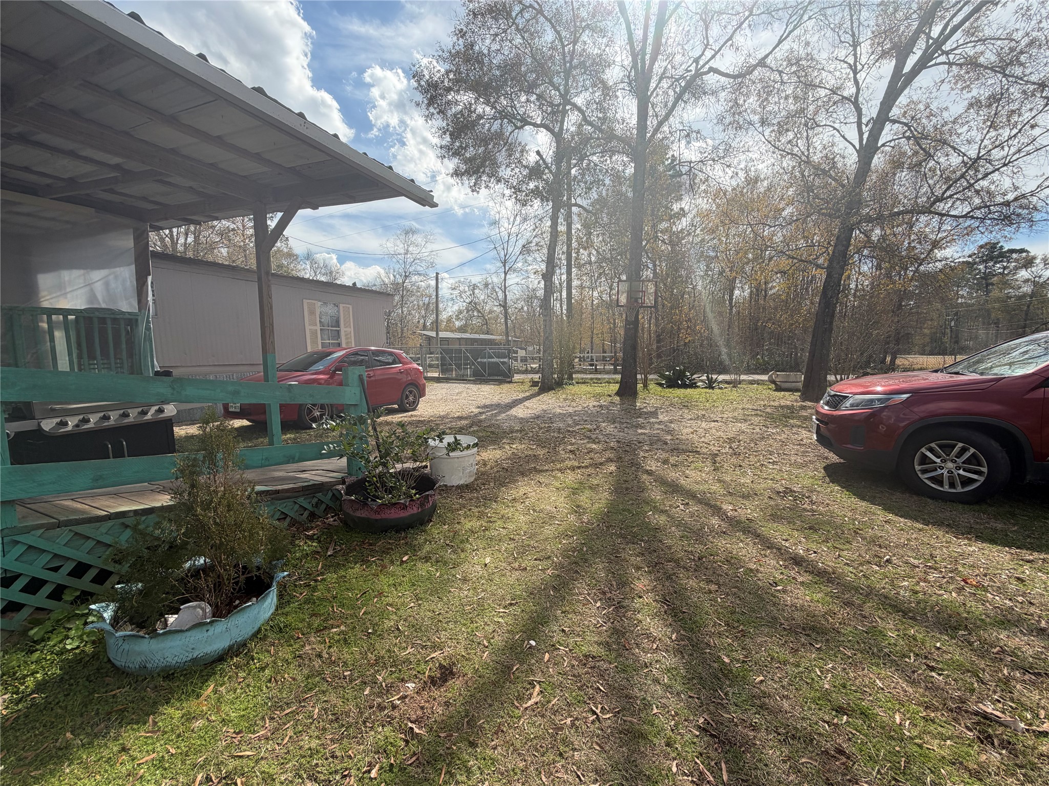 11 June Lane Shepherd, TX 77371 - Photo 6 of 33 a view of a backyard with table and chairs