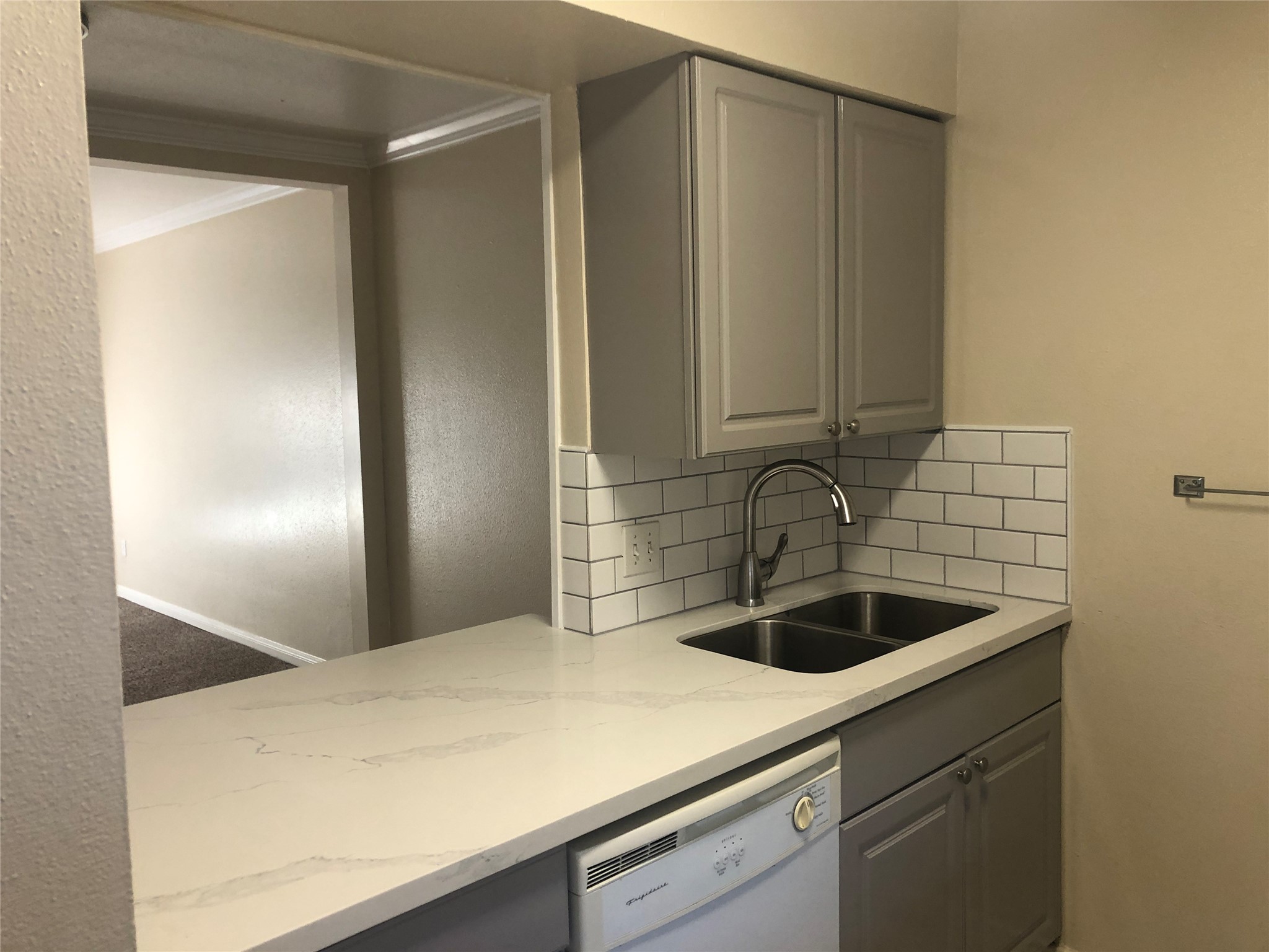 3332 Burke Road, Unit 83 Pasadena, TX 77504 - Photo 10 of 11 a kitchen with a sink and cabinets