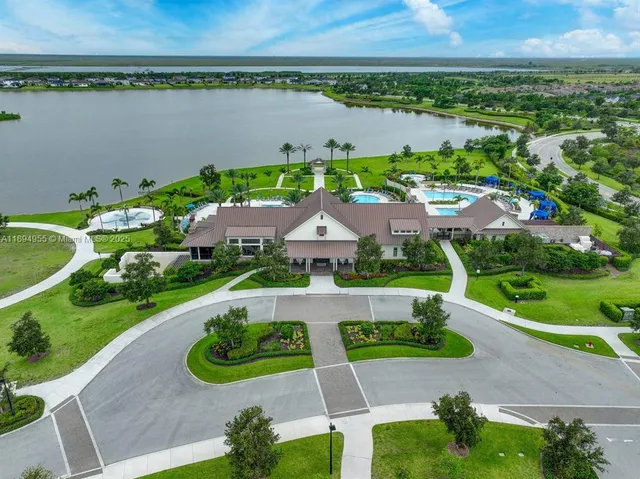 an aerial view of a house with a swimming pool and outdoor space