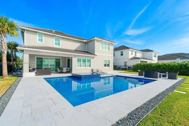a view of a house with swimming pool