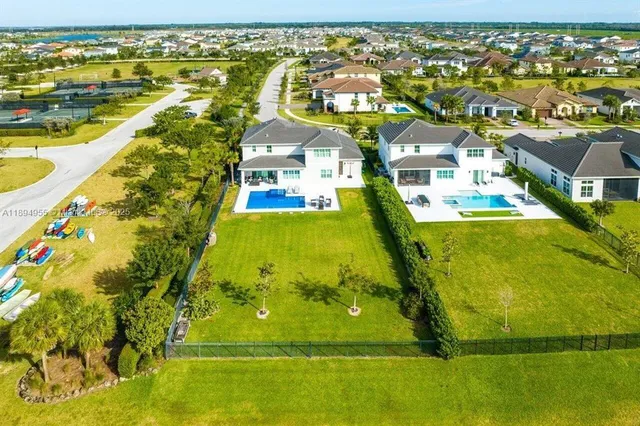 an aerial view of residential houses with outdoor space