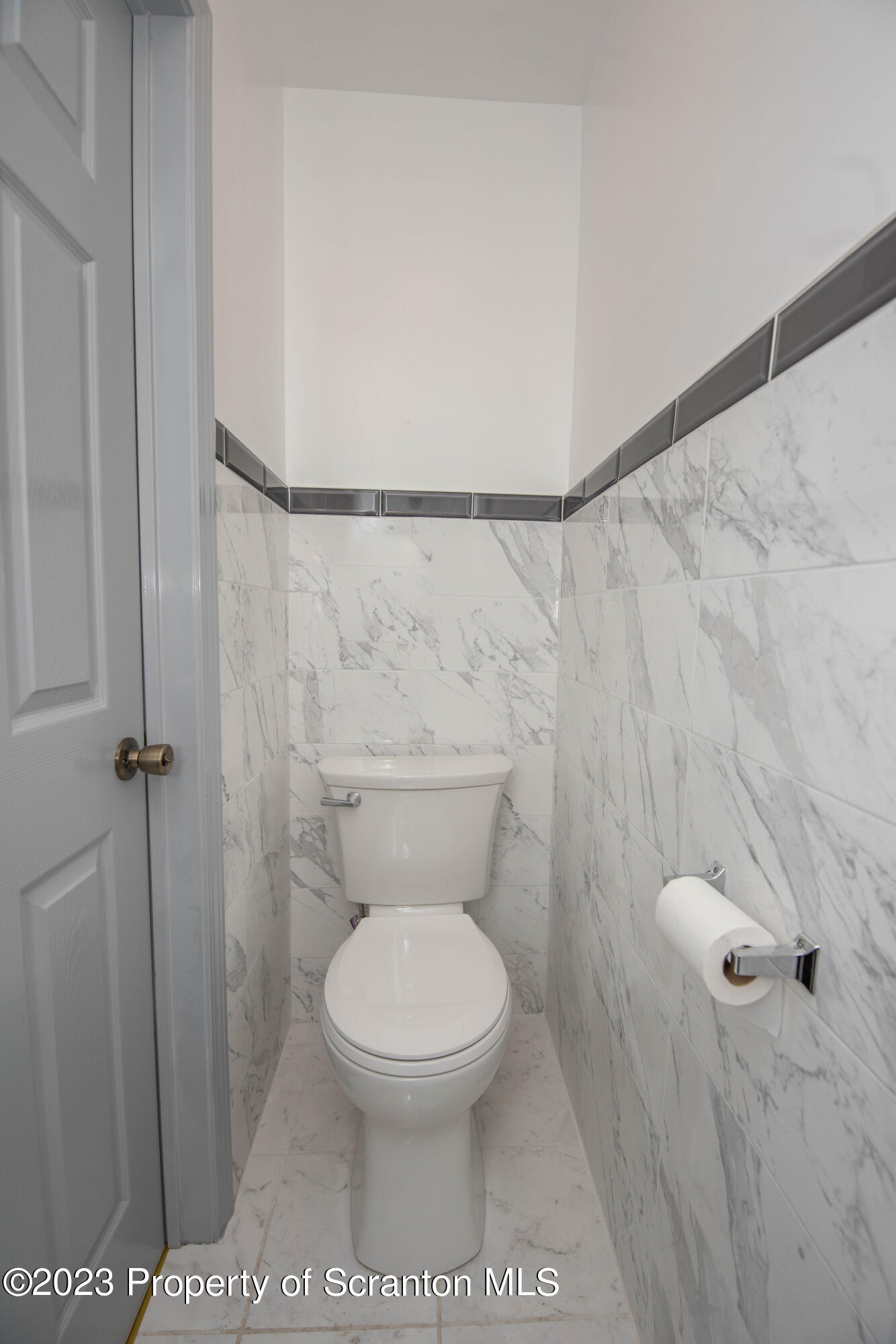 124 Delaware Avenue Olyphant, PA 18447 - Photo 12 of 30 a white toilet sitting next to a shower