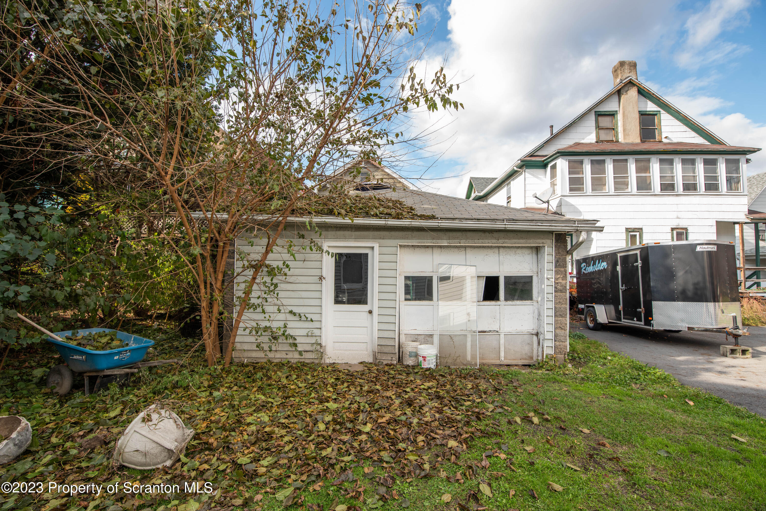 124 Delaware Avenue Olyphant, PA 18447 - Photo 24 of 30 a front view of a house with a garden