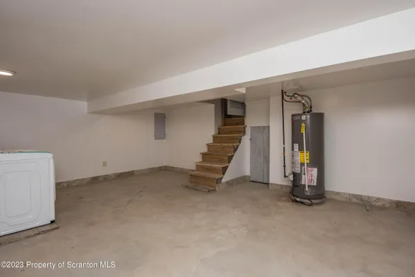 a view of an empty room with stairs