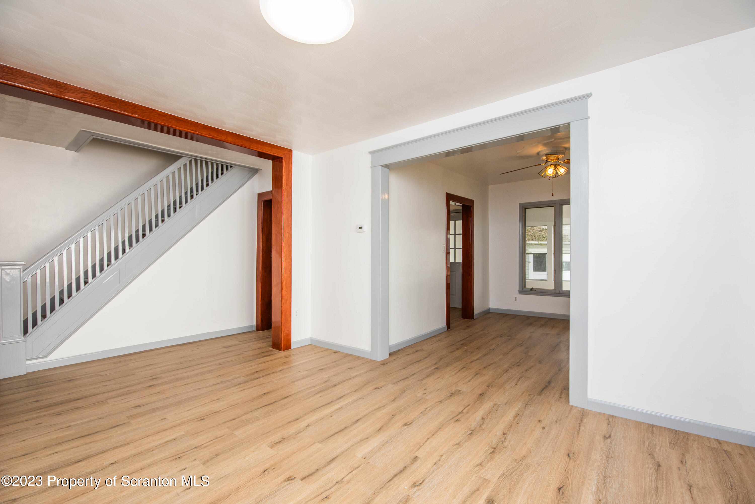 124 Delaware Avenue Olyphant, PA 18447 - Photo 3 of 30 a view of hallway with wooden floor