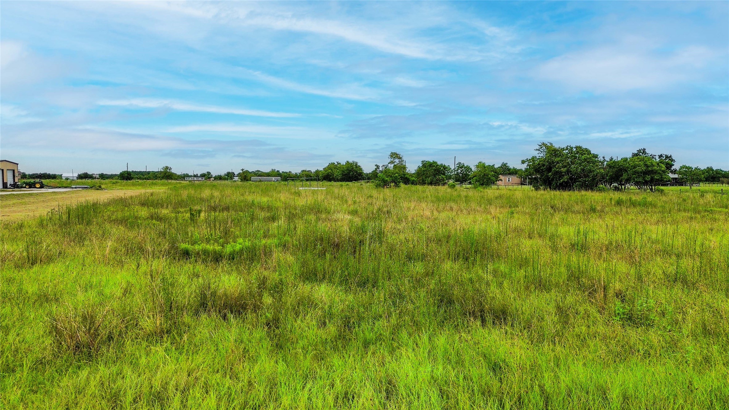 1409 Airline Road West Rosharon, TX 77583 - Photo 6 of 6 a view of a lake with houses in the back