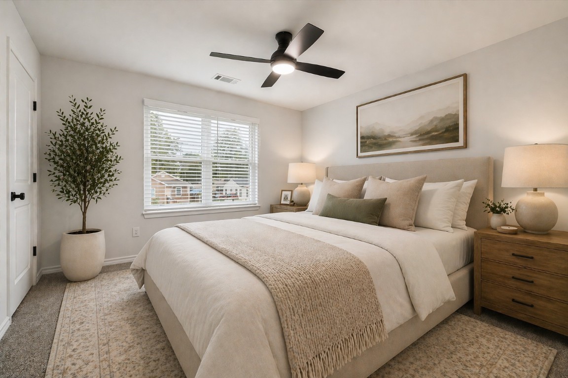 978 Marjorie Street, Unit 1 Houston, TX 77088 - Photo 3 of 12 a bedroom with a large bed and a window