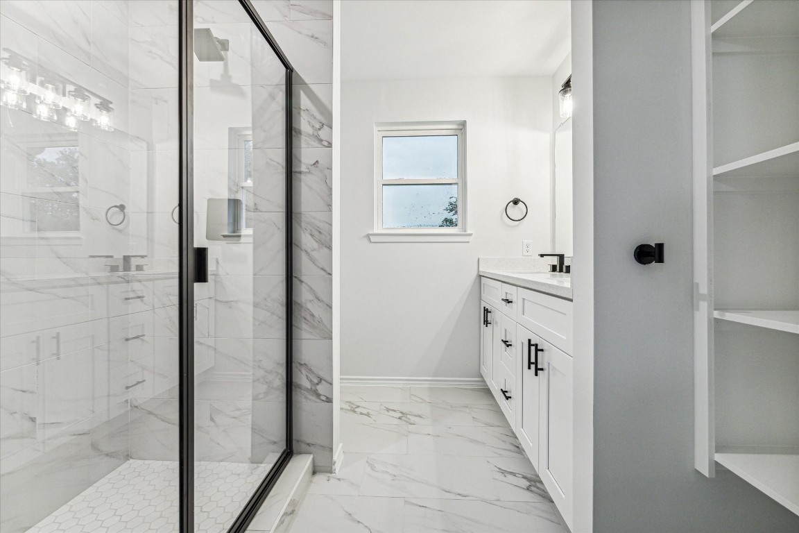978 Marjorie Street, Unit 1 Houston, TX 77088 - Photo 10 of 12 a bathroom with a double vanity sink and shower