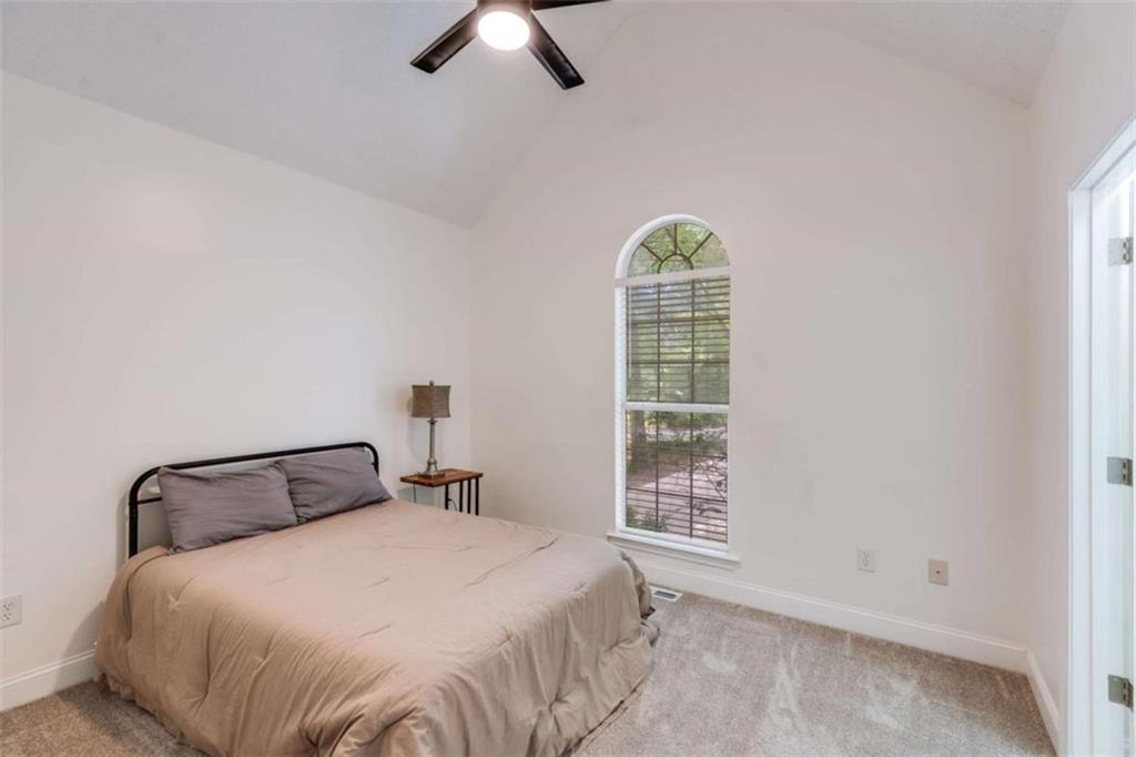 2219 Harper Drive Villa Rica, GA 30180 - Photo 15 of 25 a bedroom with a bed and a window
