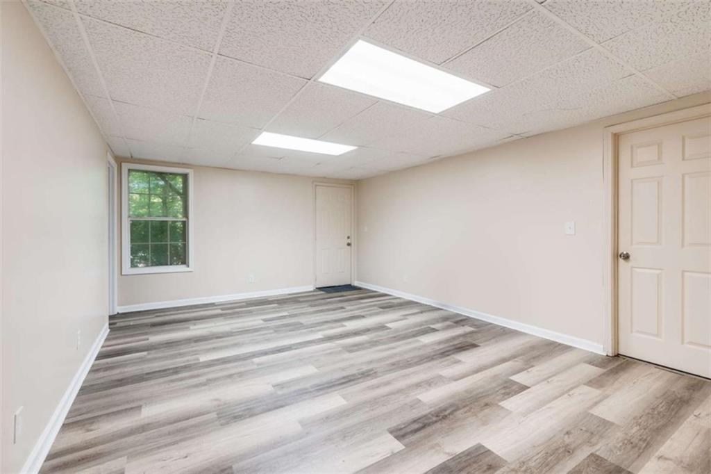 2219 Harper Drive Villa Rica, GA 30180 - Photo 21 of 25 a view of empty room with wooden floor and fan