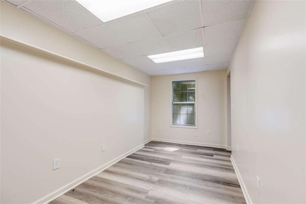 2219 Harper Drive Villa Rica, GA 30180 - Photo 22 of 25 a view of an empty room with wooden floor and a window