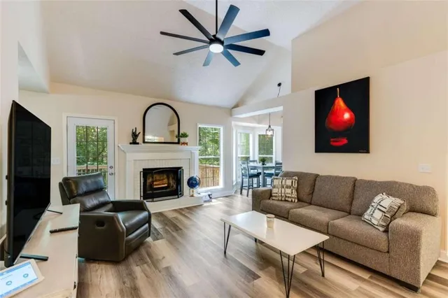 a living room with furniture fireplace and window