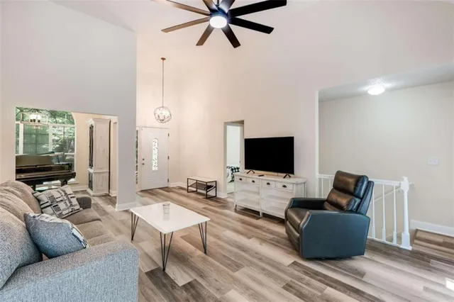 a living room with furniture and a flat screen tv