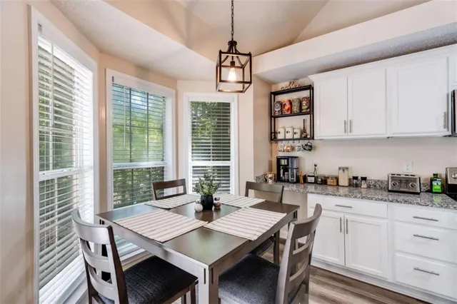a view of a dining room with furniture window and outside view