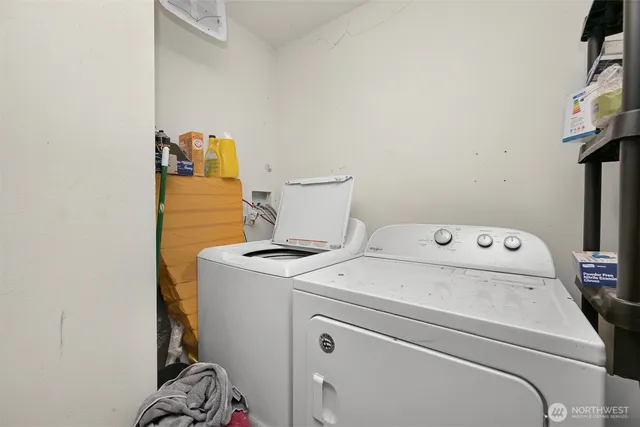 a bed sitting in a bedroom next to a couch