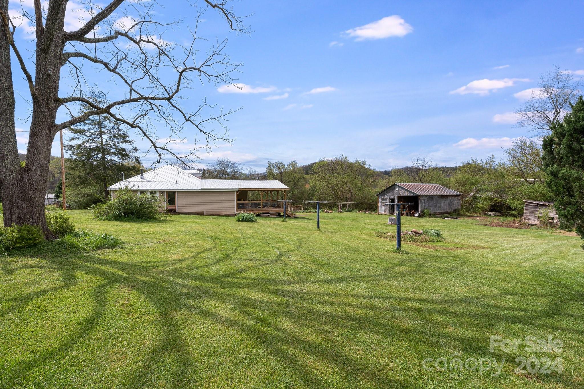 99 Cook Road Hot Springs, NC 28743 - Photo 24 of 26 a front view of a house with a yard