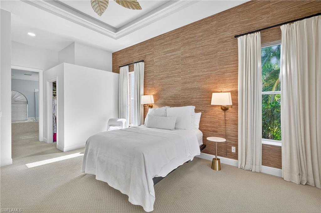2229 Goshawk Court Naples, FL 34105 - Photo 11 of 26 a bedroom with a bed and a large window