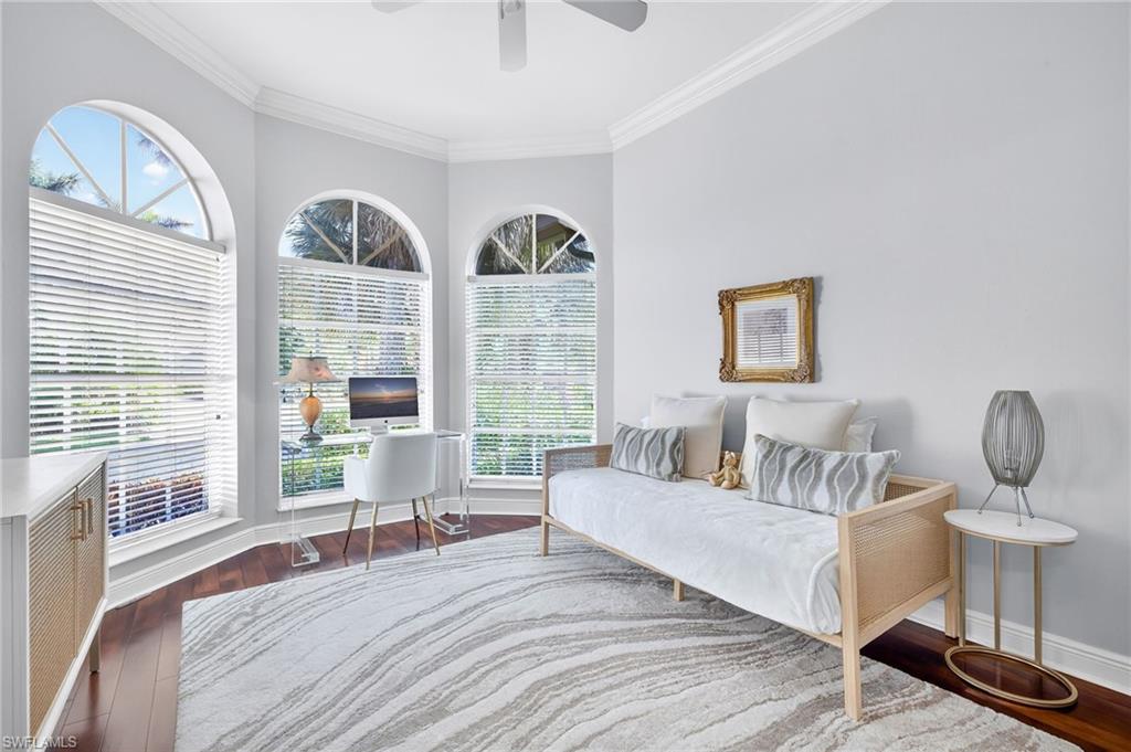 2229 Goshawk Court Naples, FL 34105 - Photo 17 of 26 a living room with furniture and a large window
