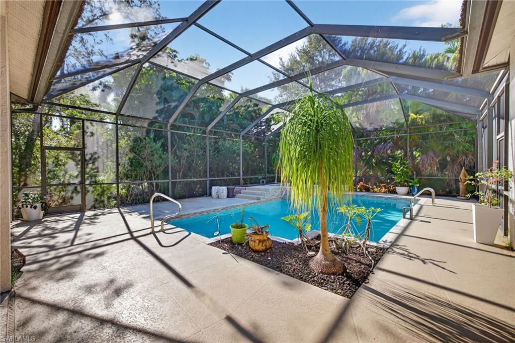 2229 Goshawk Court Naples, FL 34105 - Photo 20 of 26 a view of a couches with wooden floor