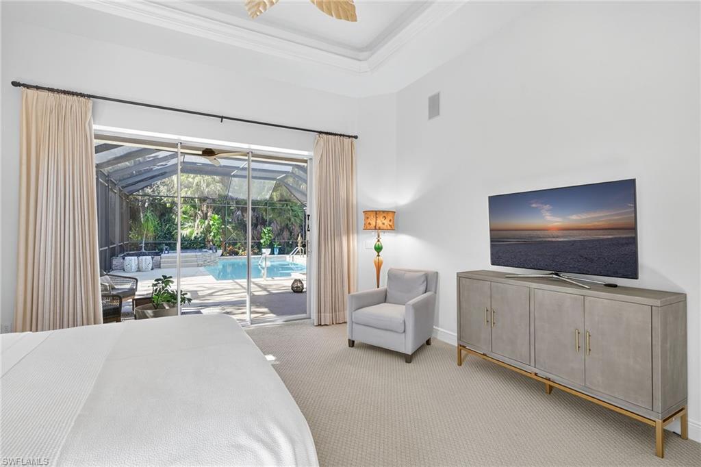 2229 Goshawk Court Naples, FL 34105 - Photo 10 of 26 a living room with furniture and a flat screen tv