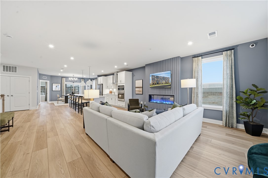 9881 Tuco Street, Unit B Glen Allen, VA 23059 - Photo 11 of 50 a living room with furniture and a large window