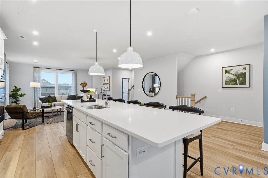 9881 Tuco Street, Unit B Glen Allen, VA 23059 - Photo 17 of 50 a kitchen with a table and chairs in it