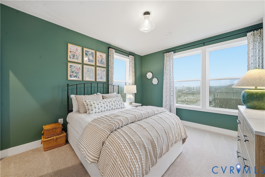 9881 Tuco Street, Unit B Glen Allen, VA 23059 - Photo 22 of 50 a bedroom with a bed and a large window