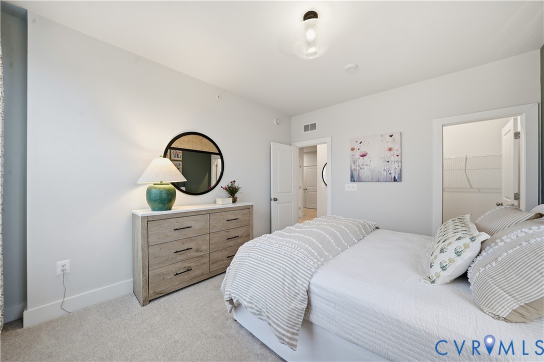 9881 Tuco Street, Unit B Glen Allen, VA 23059 - Photo 23 of 50 a bedroom with a bed and a dresser