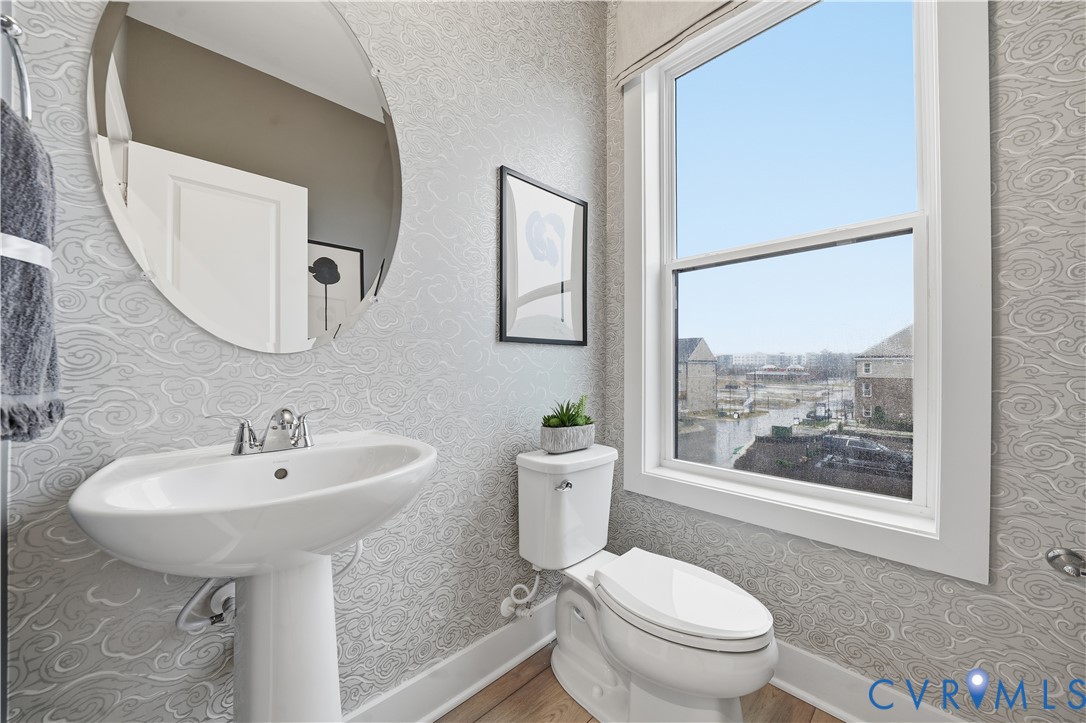 9881 Tuco Street, Unit B Glen Allen, VA 23059 - Photo 27 of 50 a bathroom with a toilet a sink and a mirror