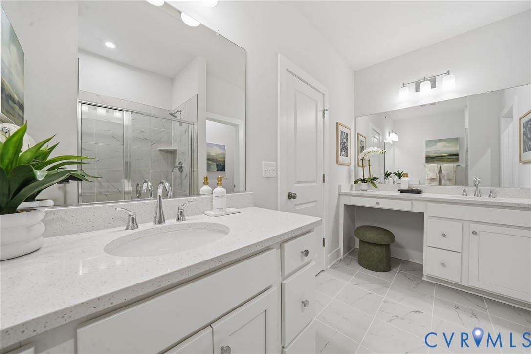 9881 Tuco Street, Unit B Glen Allen, VA 23059 - Photo 33 of 50 a bathroom with a sink double vanity and a mirror