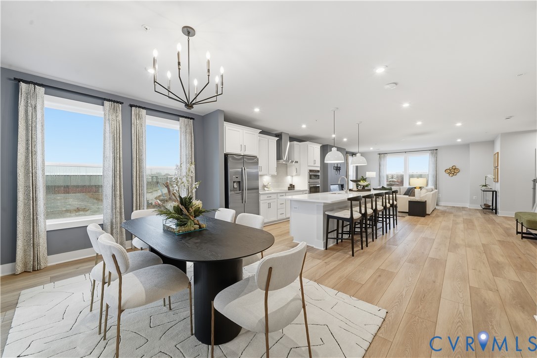 9881 Tuco Street, Unit B Glen Allen, VA 23059 - Photo 5 of 50 a view of a dining room with furniture window and outside view