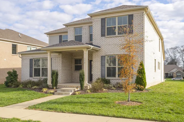 front view of a house with a yard