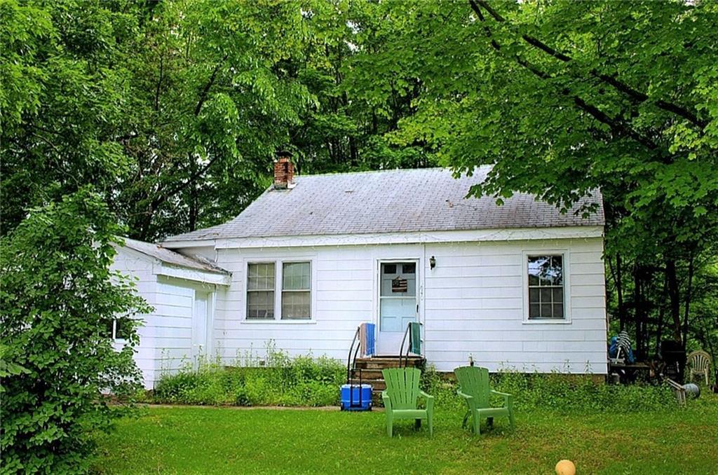 634 Kent Road New Milford, CT 06755 - Photo 1 of 1 a backyard that has potted plants and a large tree