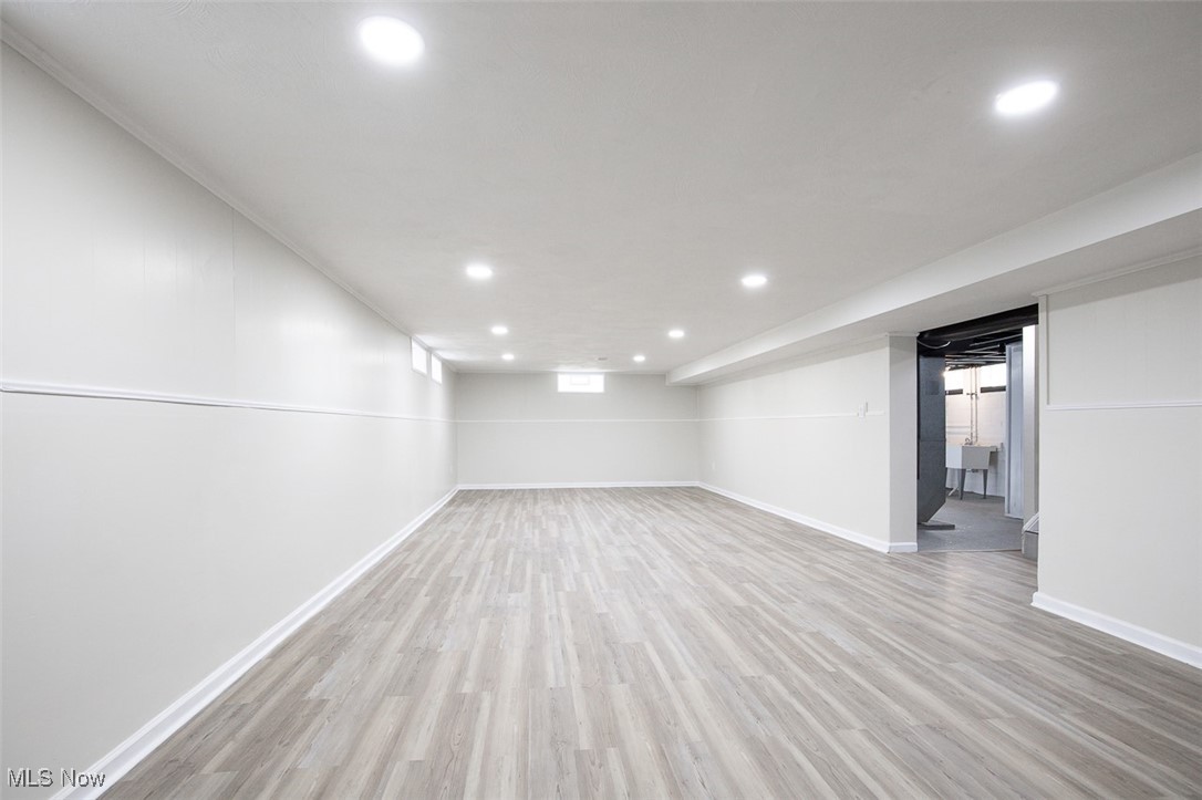 4631 Belfiore Road Cleveland, OH 44128 - Photo 19 of 28 Finished below grade area with light lvt floors and recessed lighting