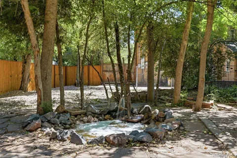 a view of a house with swimming pool and sitting area