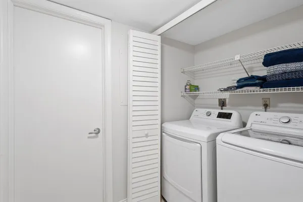a utility room with dryer and washer