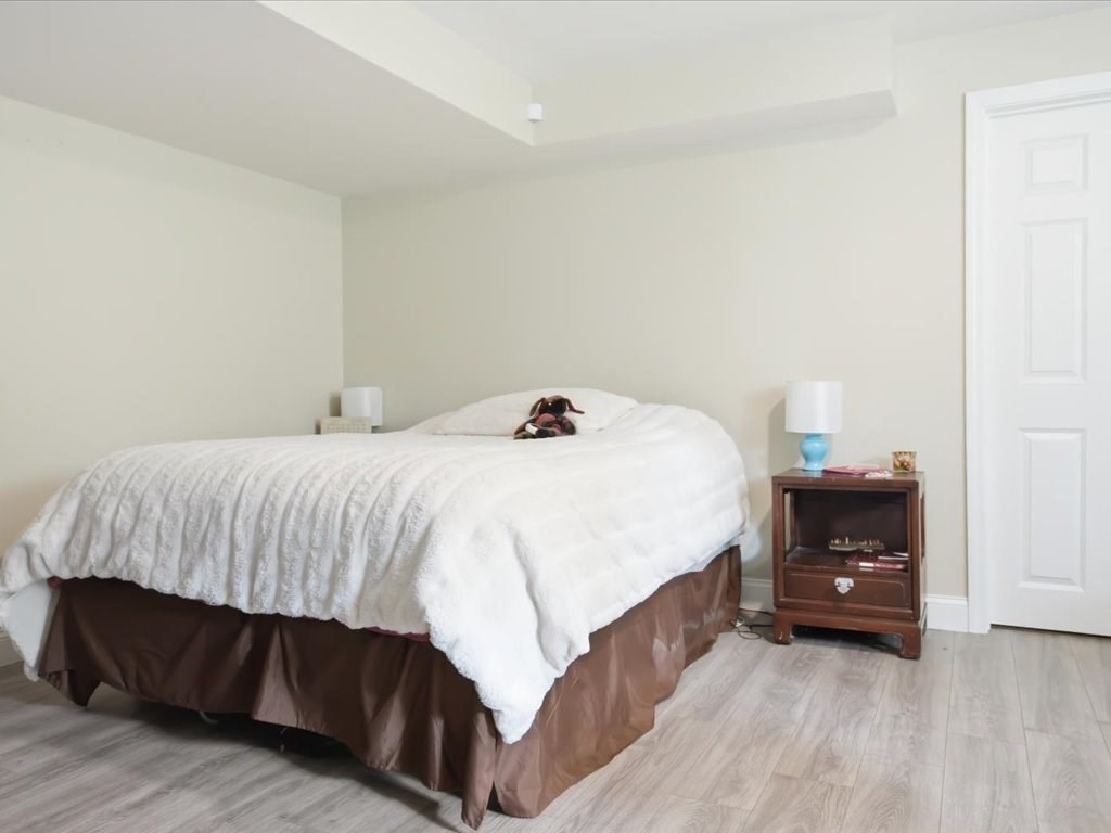 67 Ling Street Fall River, MA 02720 - Photo 27 of 32 a bedroom with a bed and a table