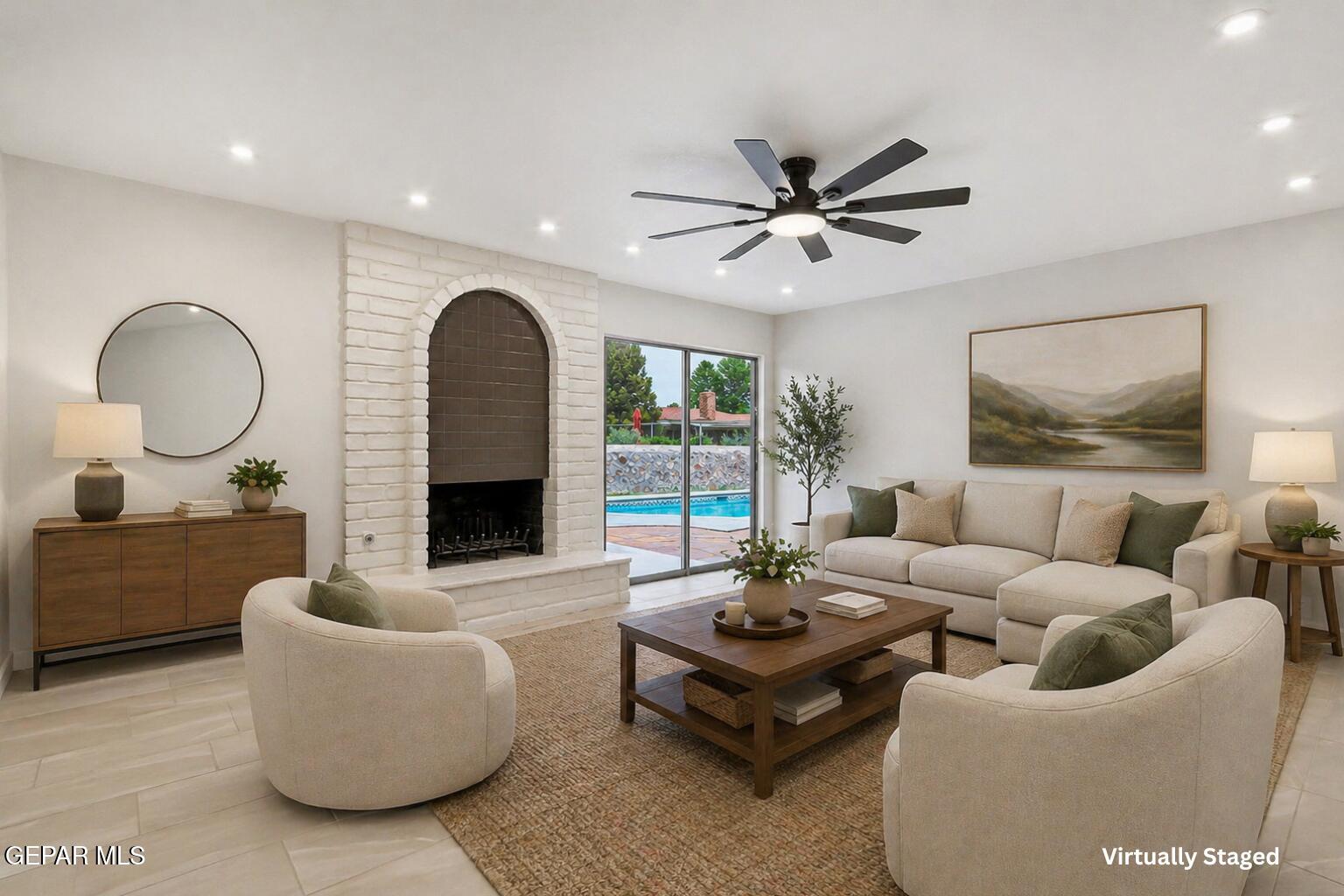 709 Frontera Road El Paso, TX 79922 - Photo 20 of 41 a living room with furniture a fireplace and a large window