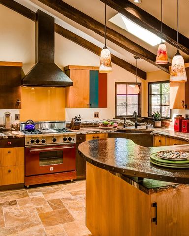a kitchen with stainless steel appliances granite countertop a stove and a sink
