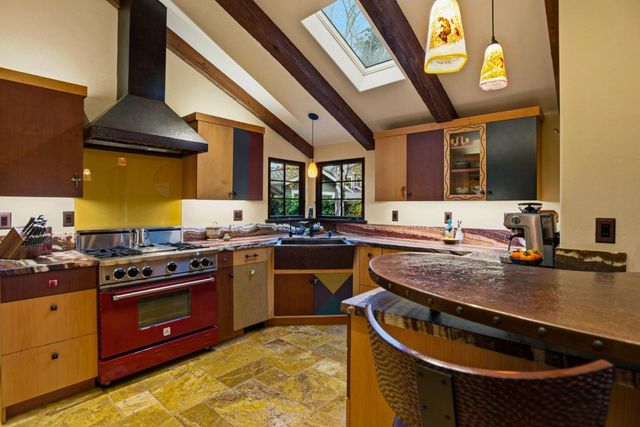 a kitchen with a stove and a sink