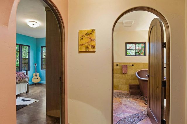 a view of an entryway with a table and a workspace