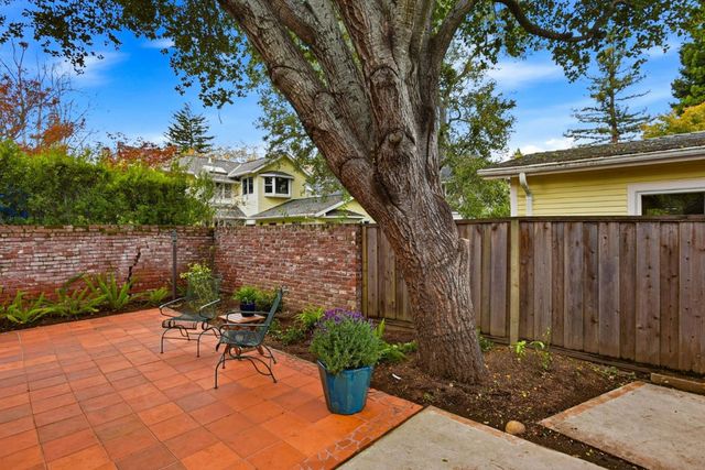 a garden view with a seating space