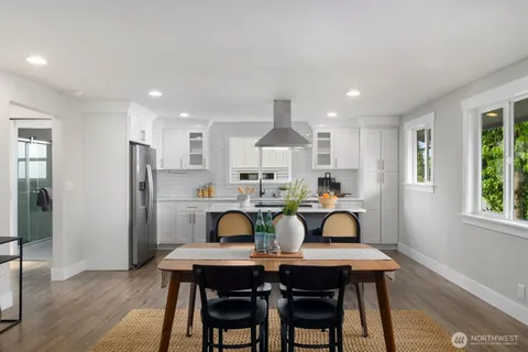 a view of a dining room with furniture and wooden floor